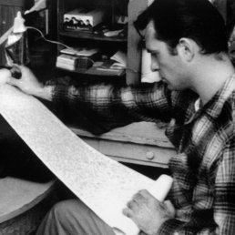 Jack Kerouac with one of his scrolls